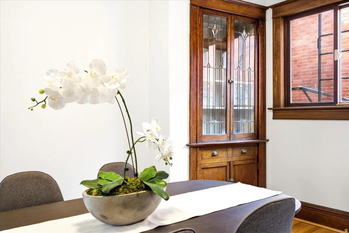 Built-in corner hutch featuring leaded glass cabinet doors and lower storage with wood-finish drawers