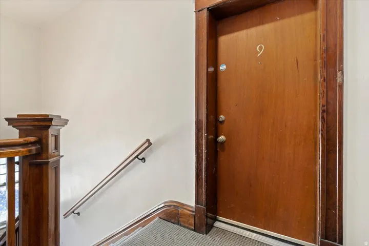 Solid wood entry door with wood trim surround