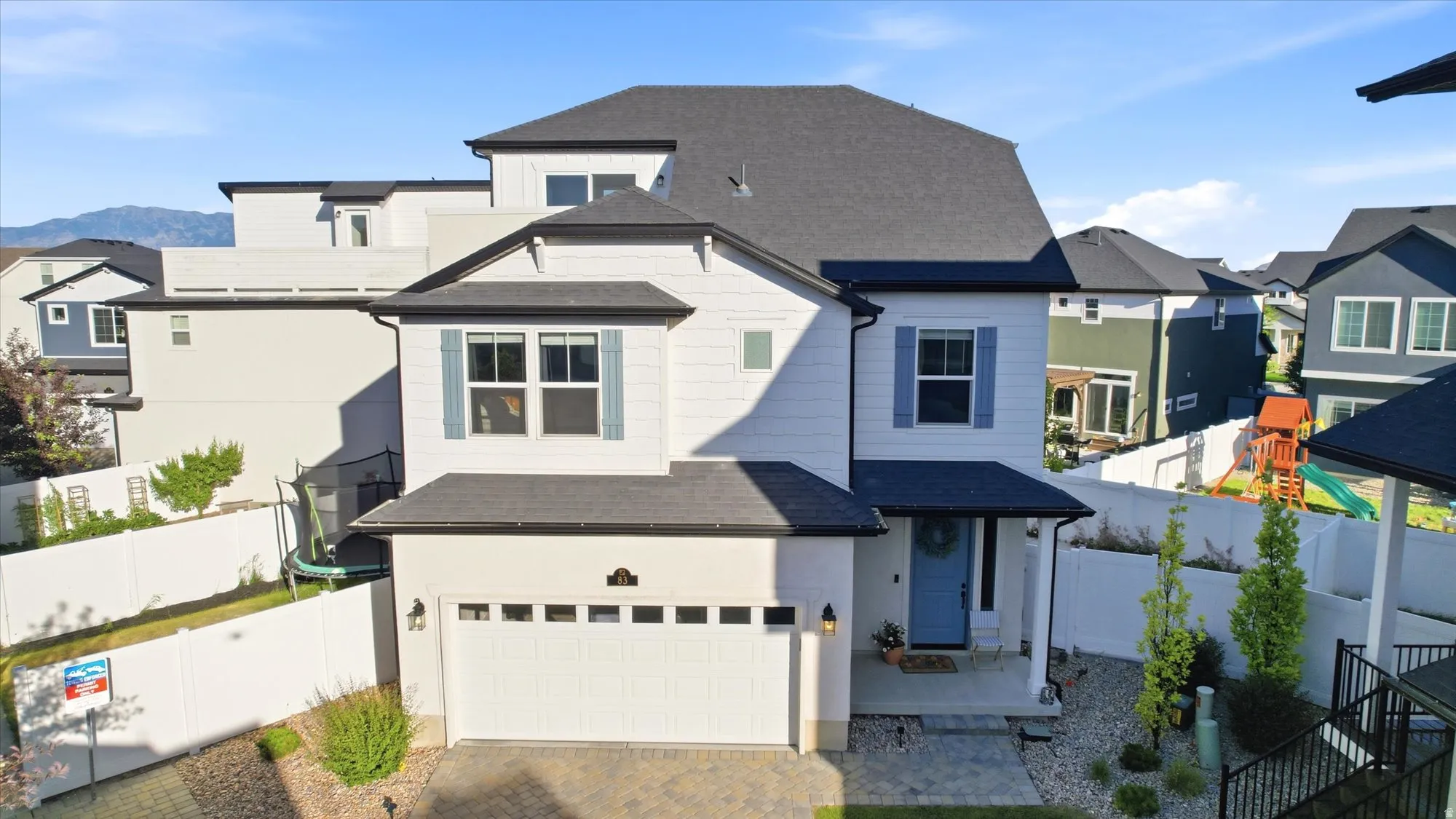 Modern white exterior with dark roofline