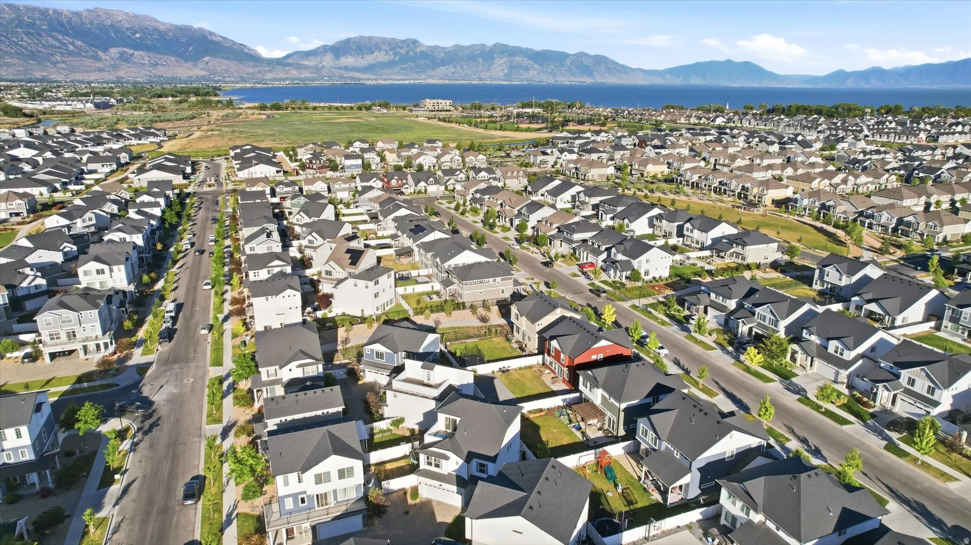 Residential neighborhood featuring diverse architectural styles and mature street trees
