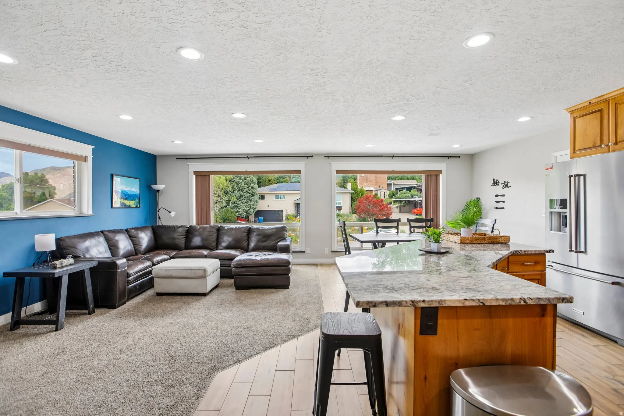 Kitchen island with a granite countertop and wood-finish cabinetry