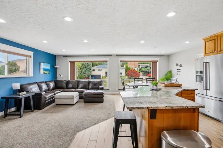 Kitchen island with a granite countertop and wood-finish cabinetry