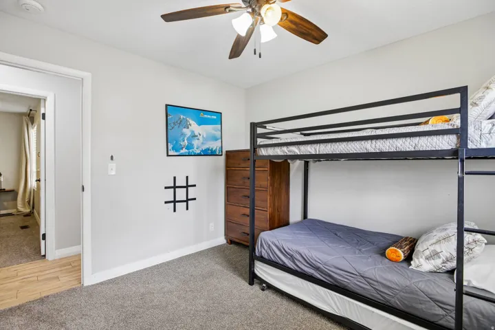Neutral-toned walls complement the gray carpeting