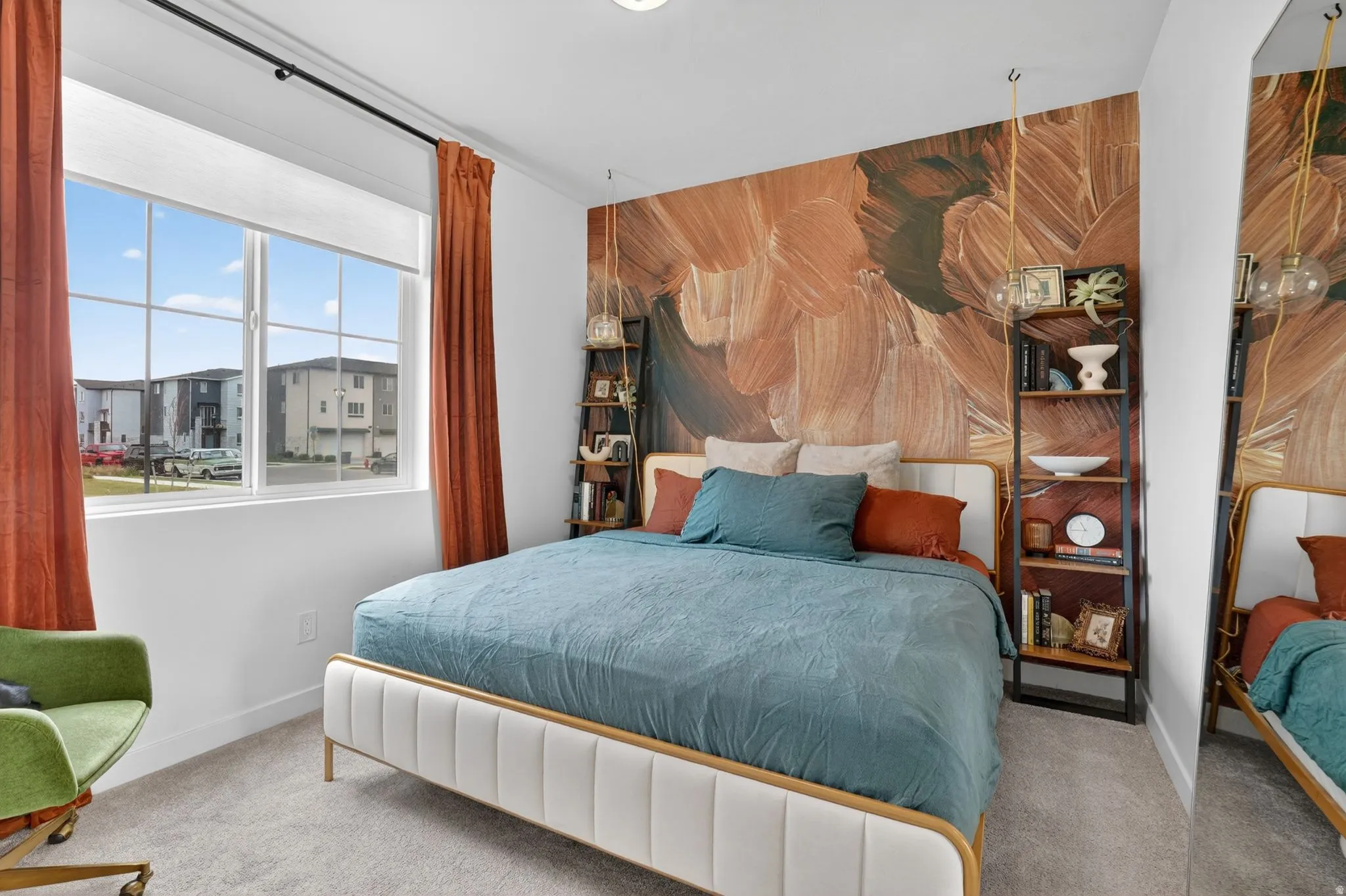 Room featuring a large window with grid panes, textured wall art, and carpet flooring