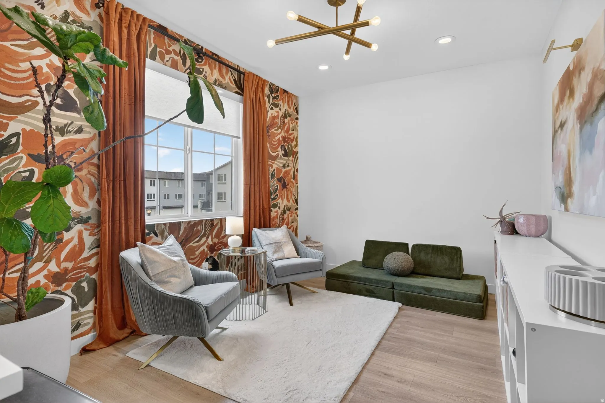 Room featuring a multi-pane window with roller shade, wood-finish flooring, and recessed lighting
