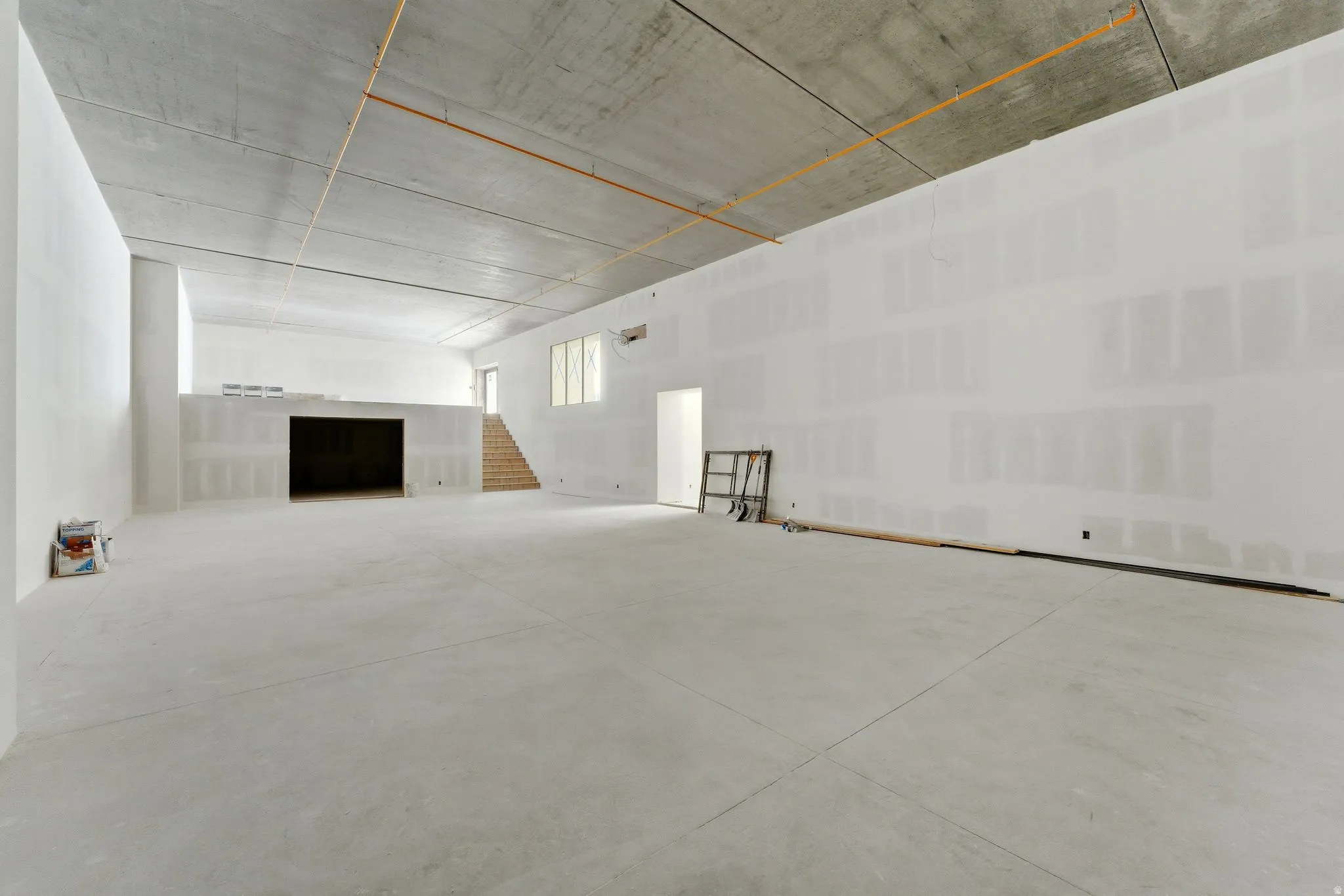 Sports court with overlook, interior and exterior access, and a large storage area.