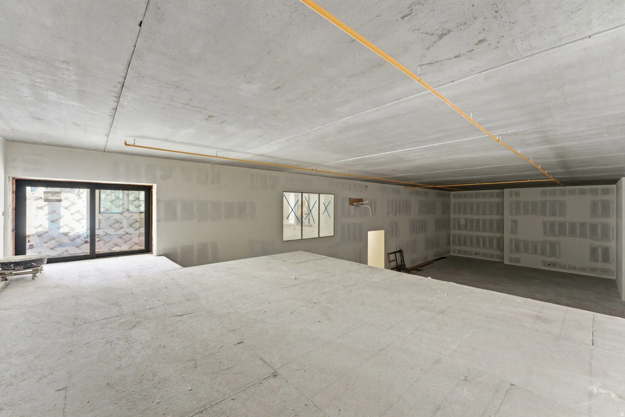 Sports court with overlook, interior and exterior access, and a large storage area.