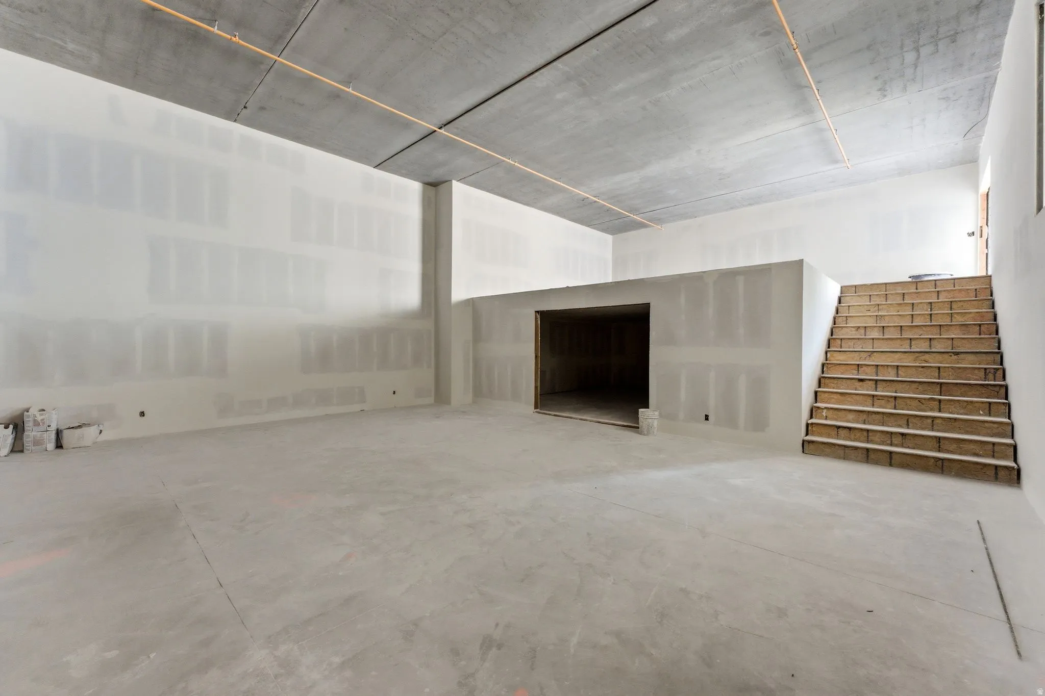 Sports court with overlook, interior and exterior access, and a large storage area.