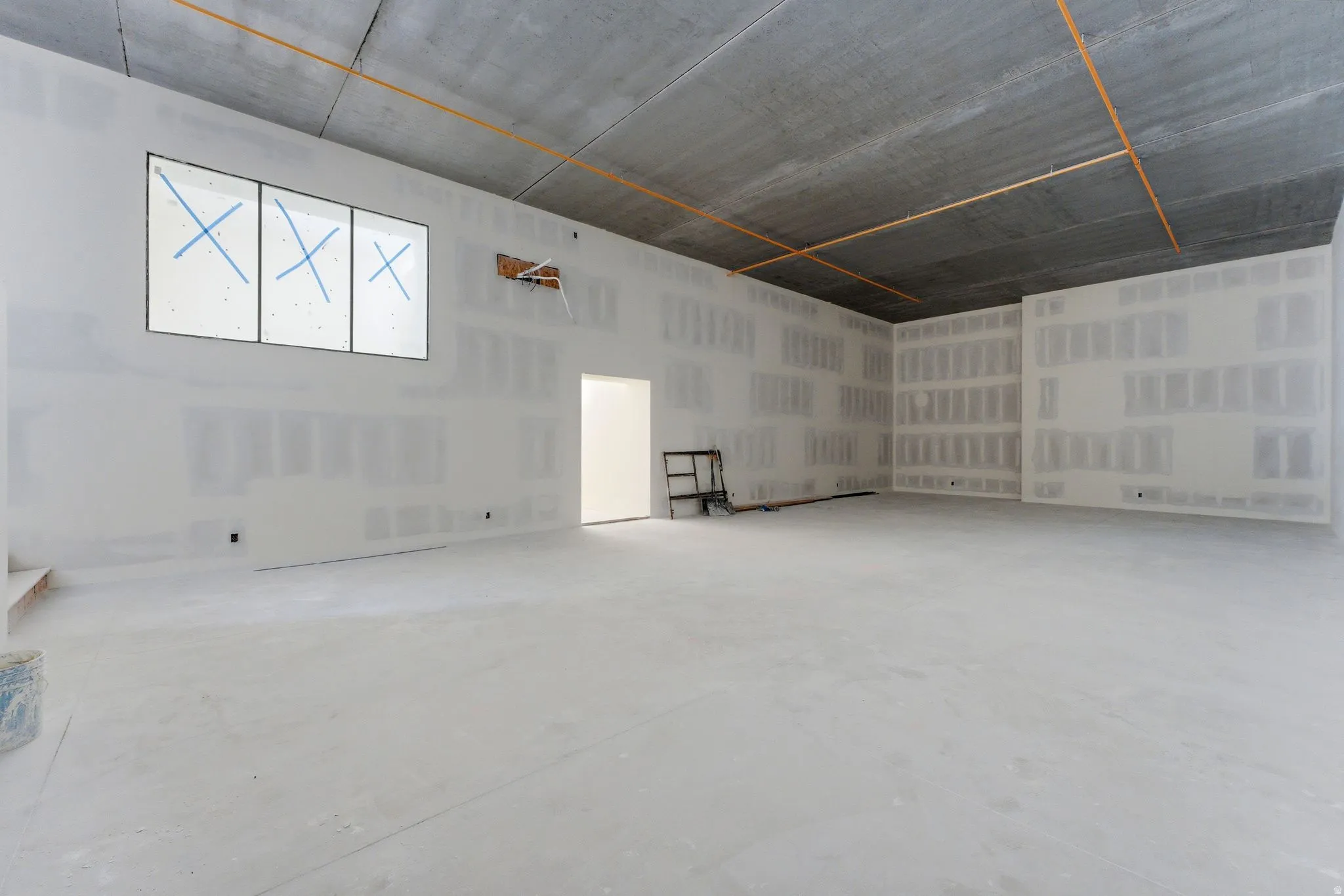 Sports court with overlook, interior and exterior access, and a large storage area.