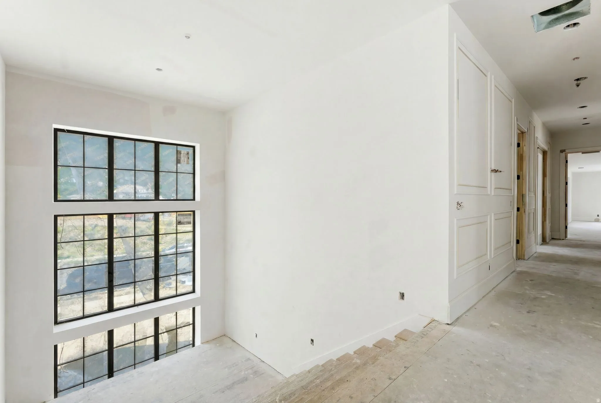 Two-story wall of grid-pattern windows