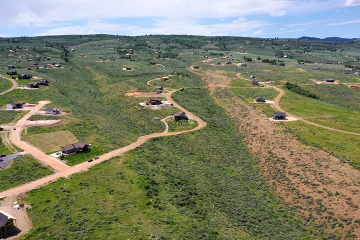 Rolling hillsides featuring established homes and undeveloped parcels