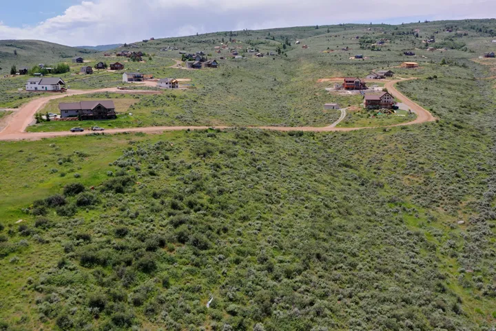 Expansive hillside property featuring natural vegetation and rolling terrain