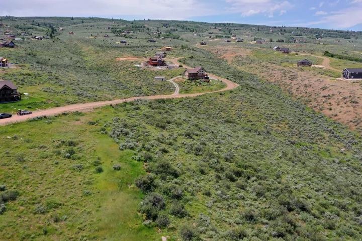 Expansive land parcel featuring natural topography and varied vegetation