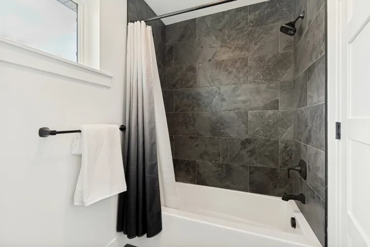 Shower and tub combination featuring matte black fixtures