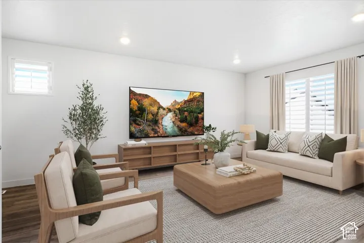 Virtually Enhanced. Recessed ceiling lighting, wood-finish flooring, plantation shutters, and a media console