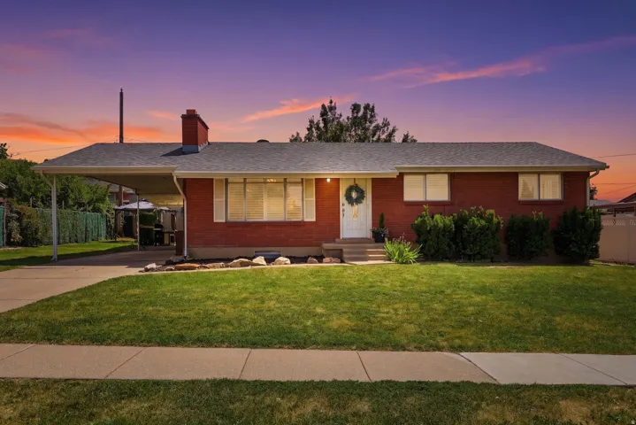 Brick exterior with an attached carport