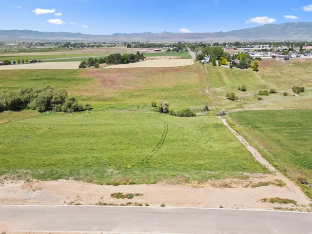 Expansive undeveloped land featuring varied terrain and distant mountain ranges