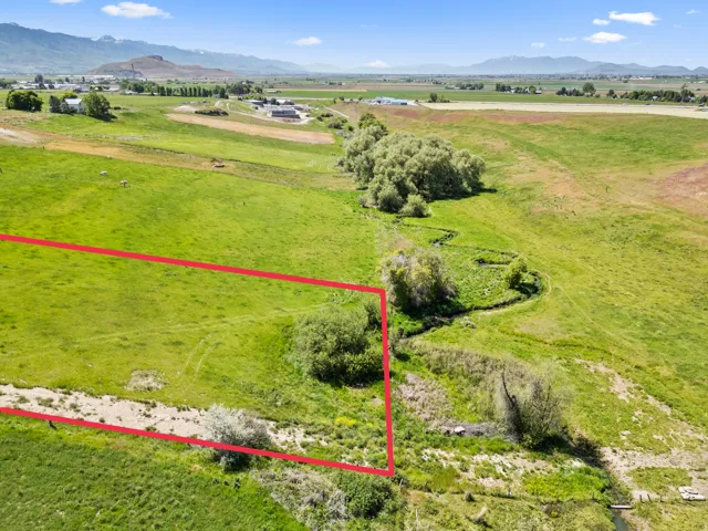 Expansive green acreage featuring a defined property boundary