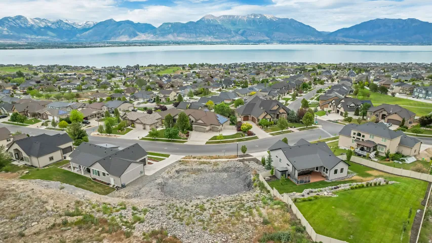 Residential development featuring a lake and mountain backdrop
