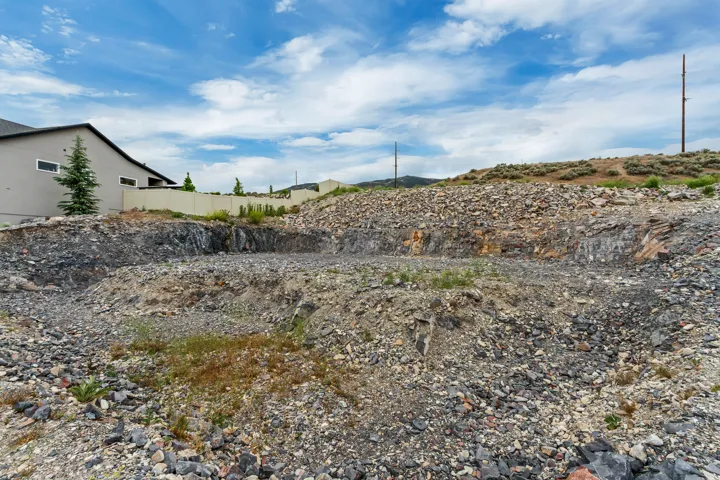 Terraced building site featuring a rocky landscape with visible bedrock