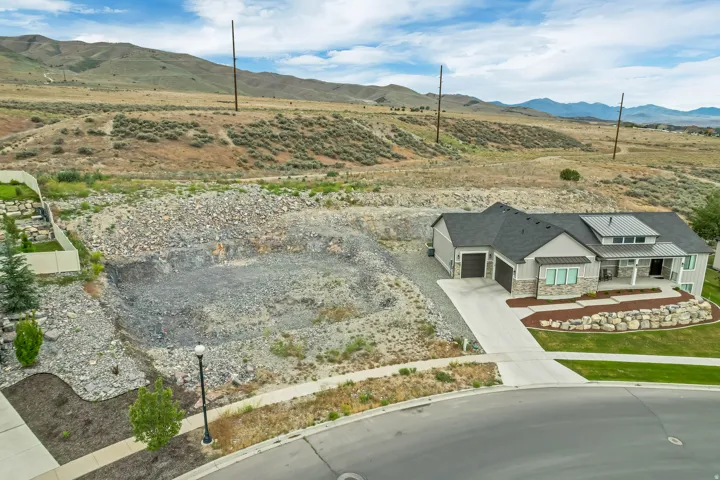 Contemporary home with gray siding and stone accents