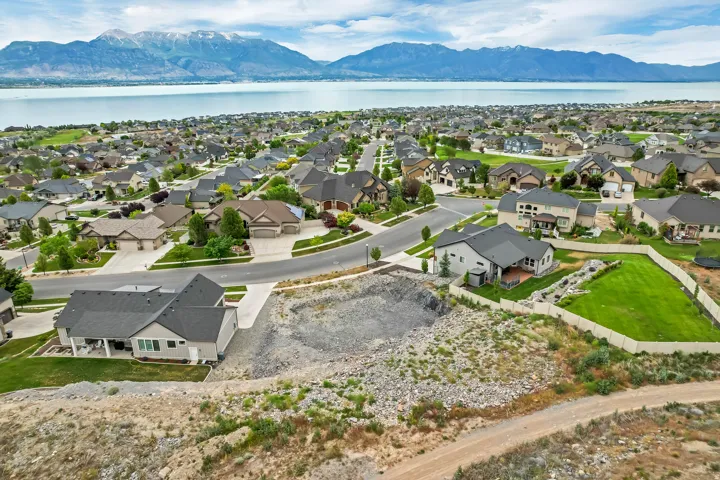 Expansive residential area featuring a large lake and distant mountains