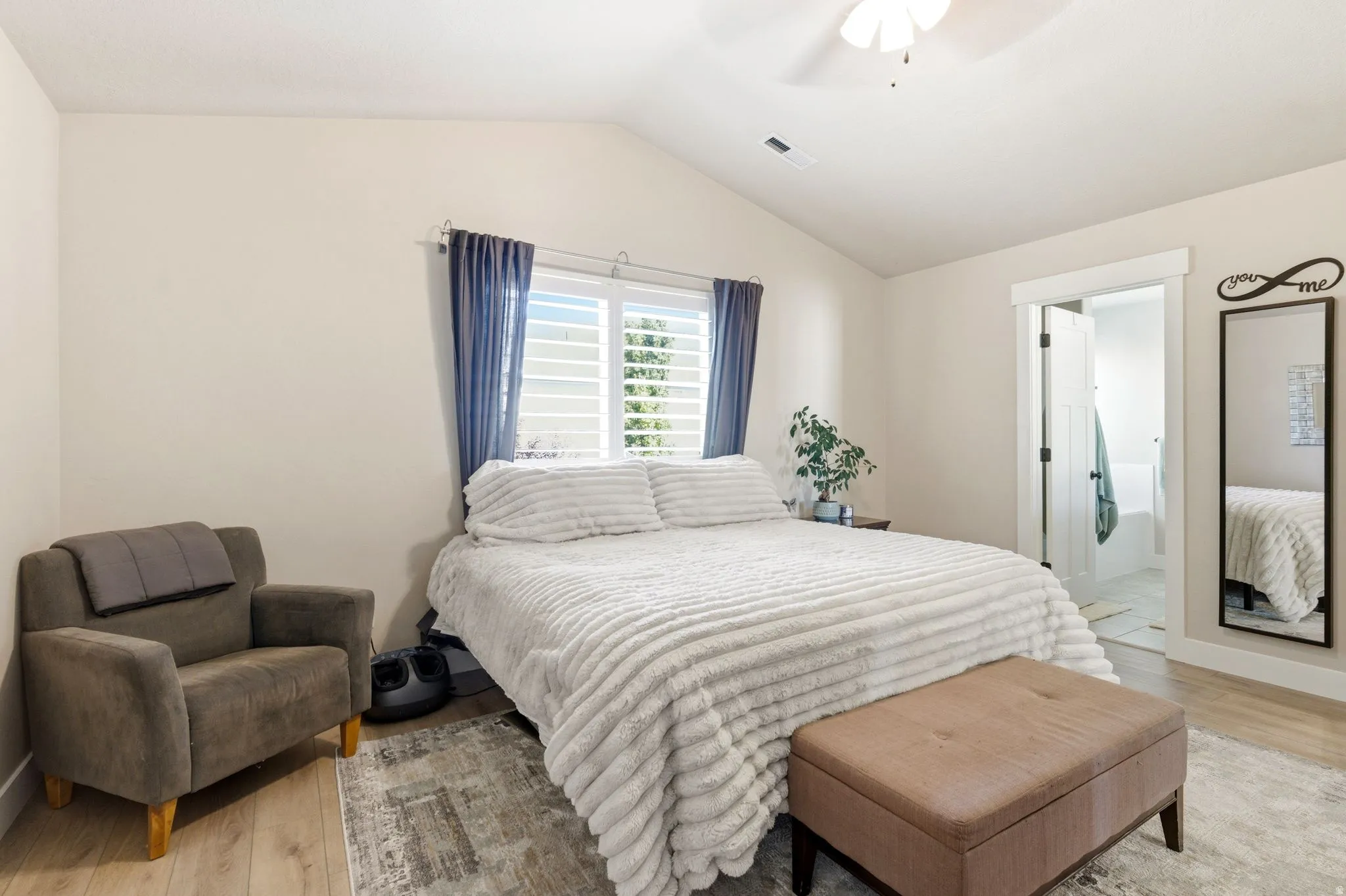 Bedroom featuring a vaulted ceiling and a ceiling fan
