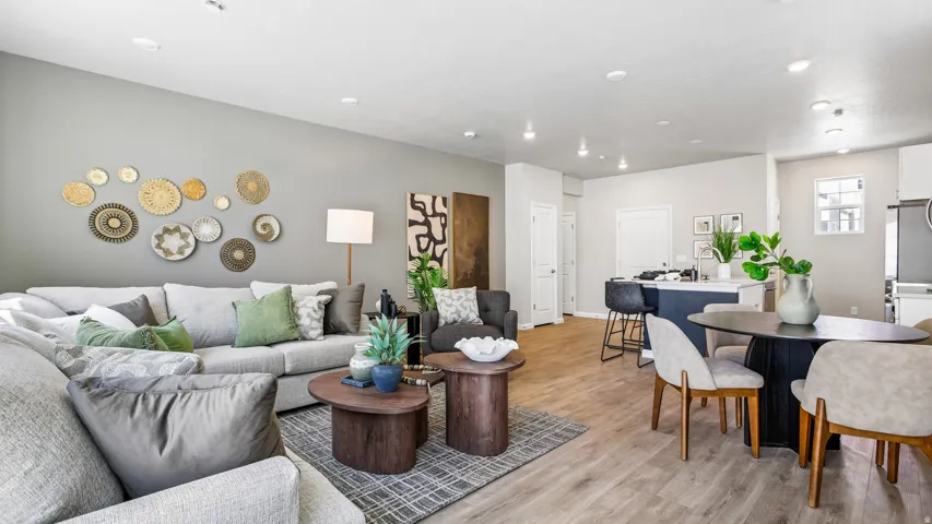 Open-concept living area featuring wood-finish flooring throughout