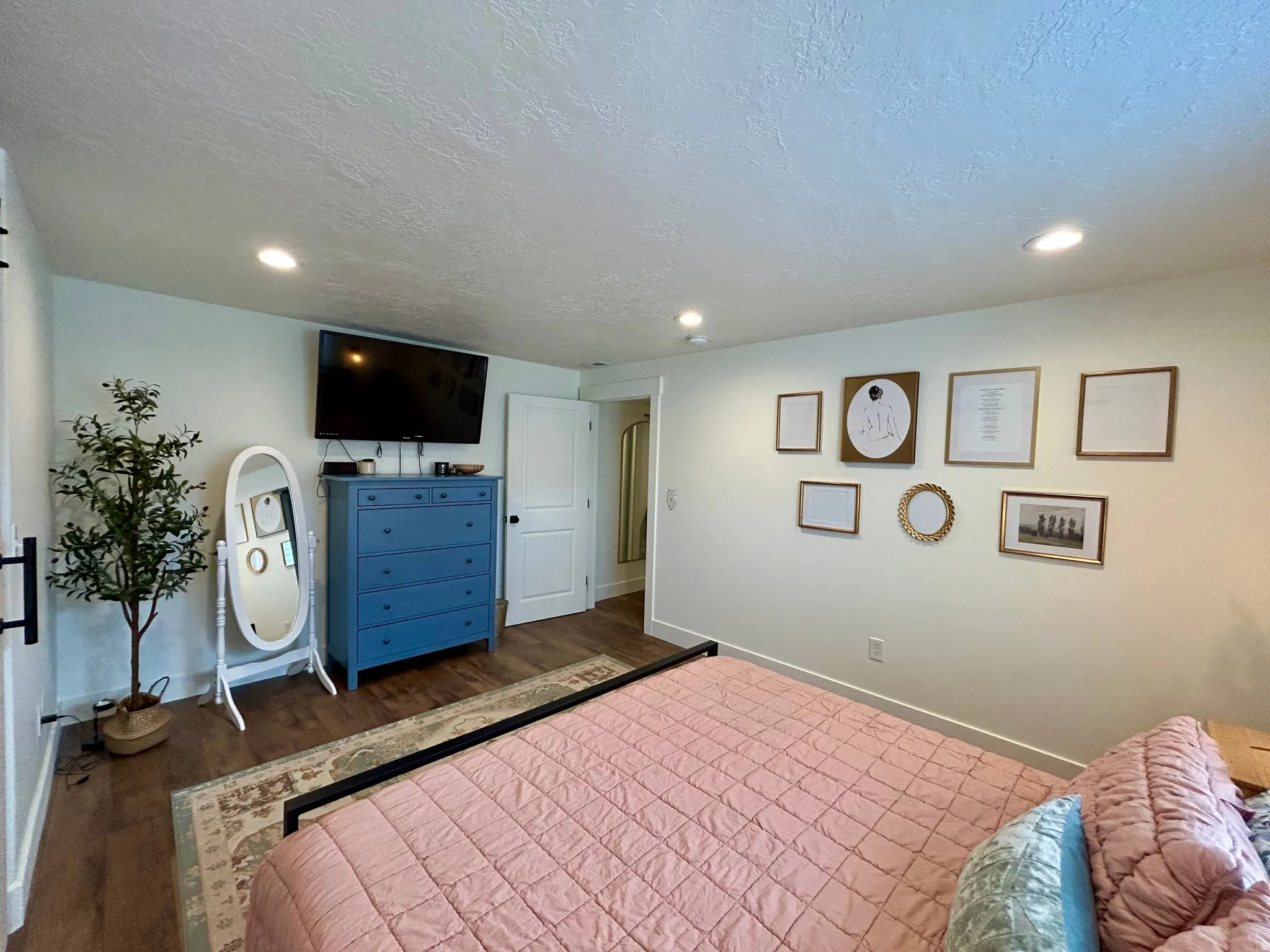 Bedroom featuring recessed lighting, wood-finish flooring, and white baseboards