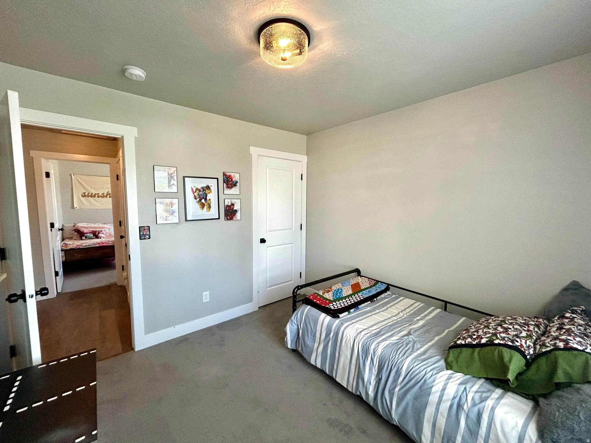 Neutral tone walls with white trim and a coordinating door