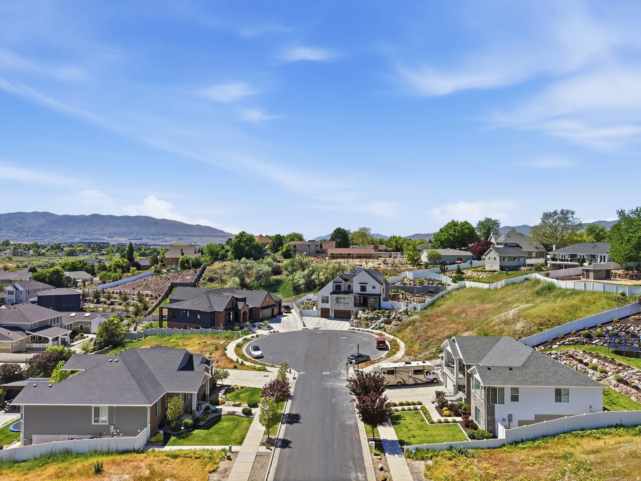 Newly developed cul-de-sac featuring multiple contemporary homes with varied architectural styles