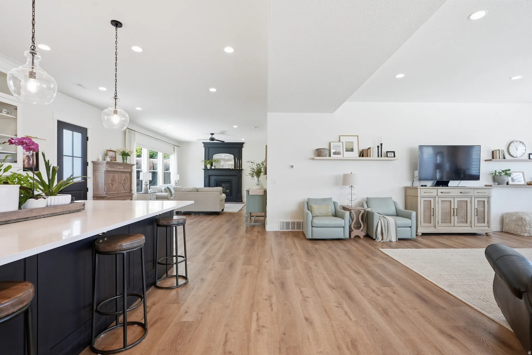 Open-concept living space with light LVP flooring