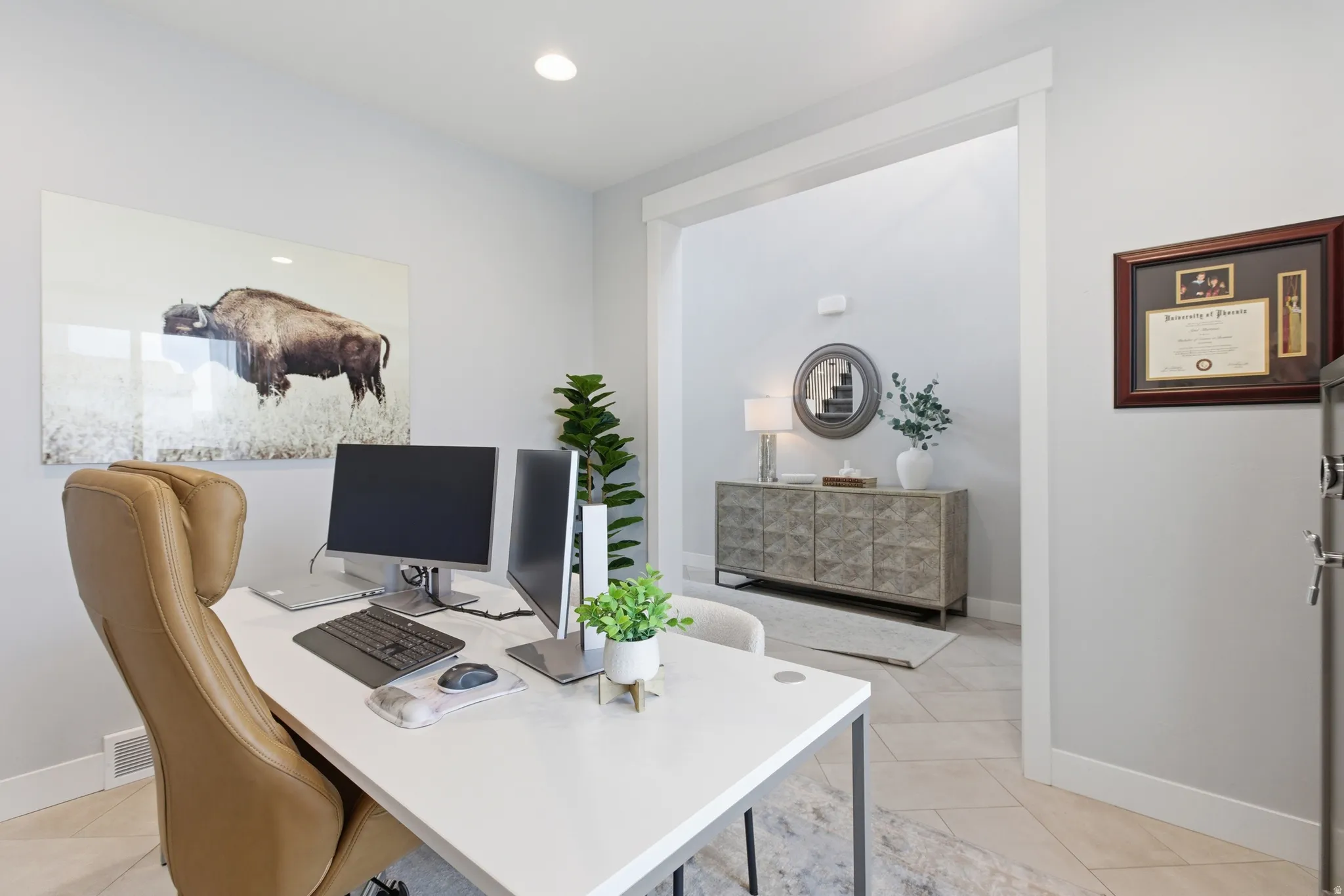 Dedicated workspace featuring recessed lighting, a wide doorway with white trim, and light-toned flooring