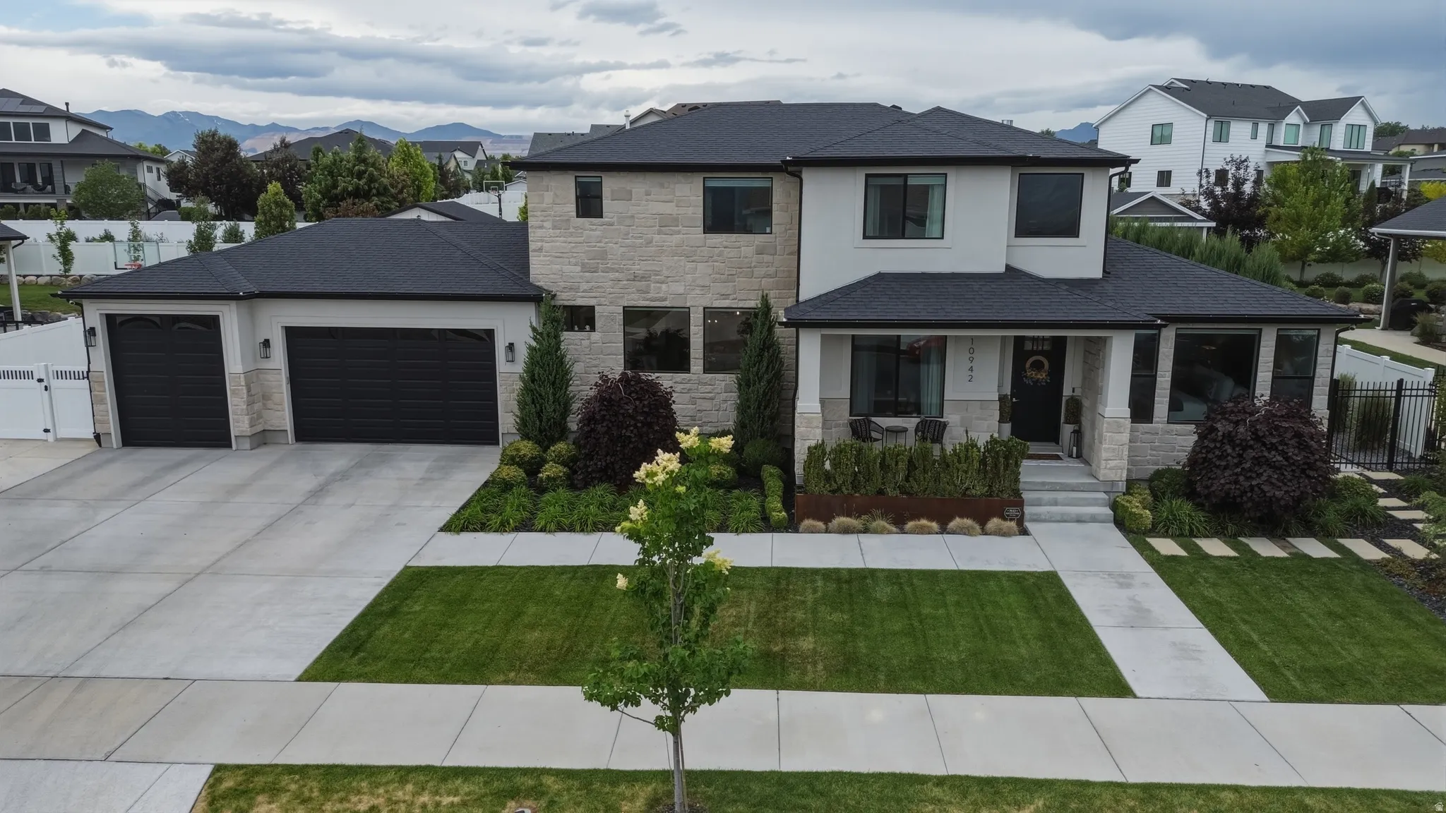 Contemporary two-story residence with a stone and stucco facade