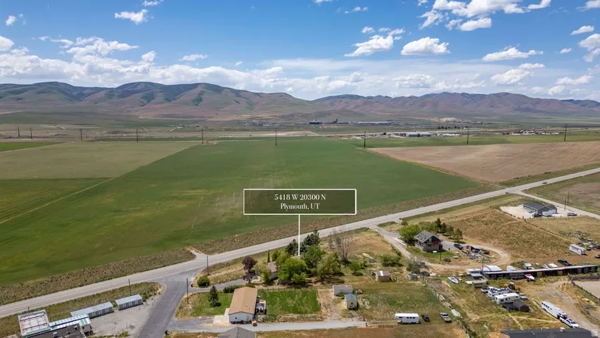 Expansive agricultural fields with distant mountainous terrain