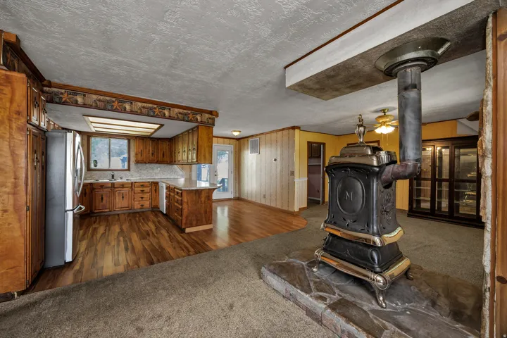 Cast iron wood-burning stove with a flagstone hearth