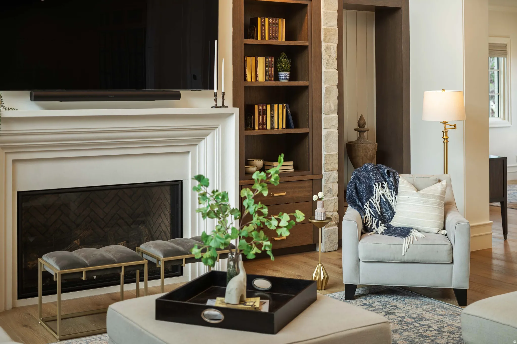 Mantle-style fireplace with an integrated firebox and herringbone brick pattern