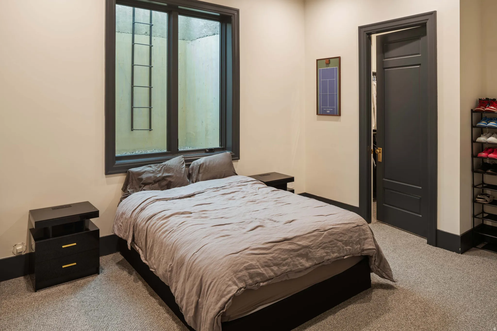 Neutral-toned walls complement the dark trim and doors, creating a contemporary aesthetic