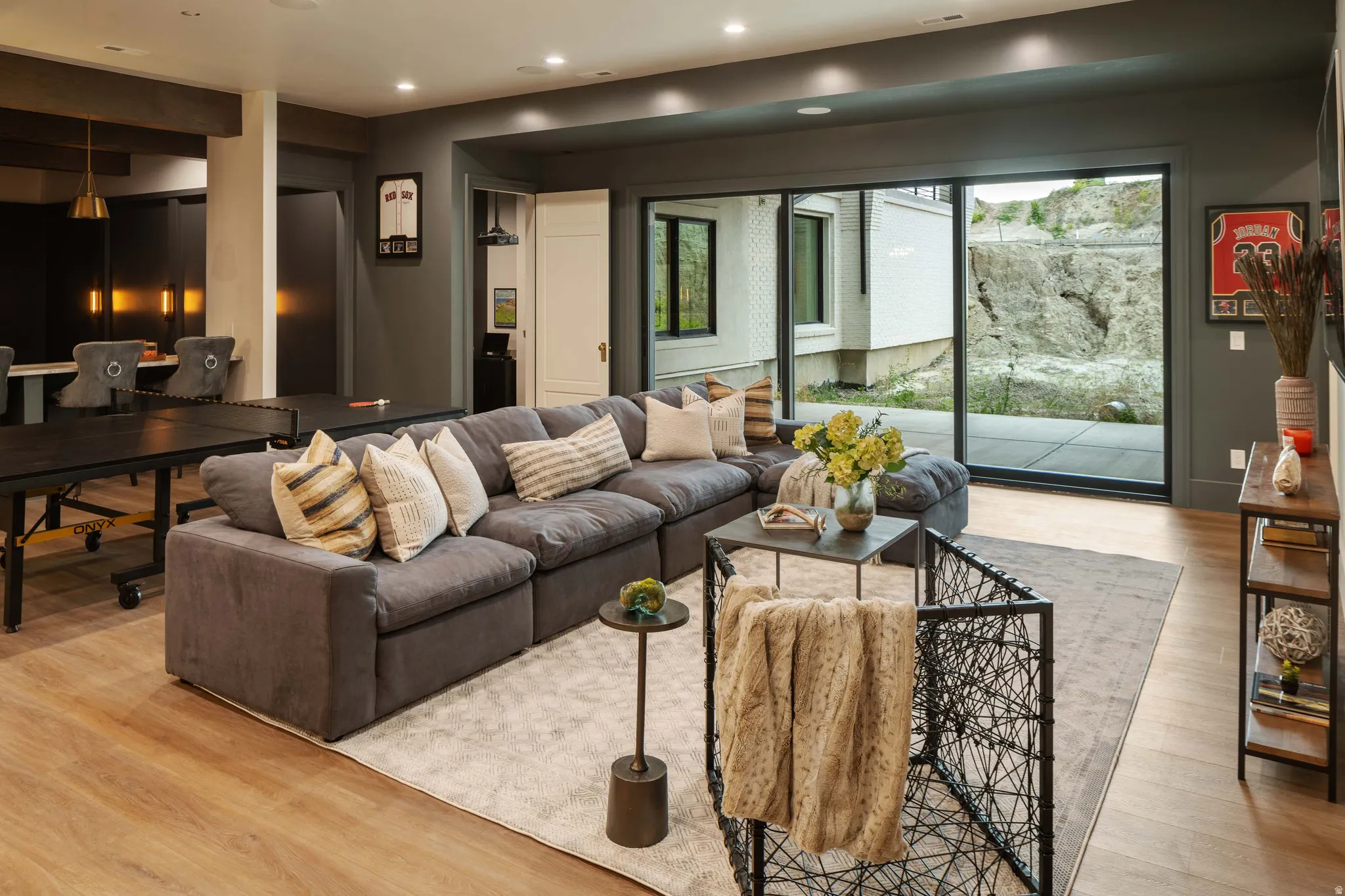 Open-concept living area featuring wood-finish flooring and recessed lighting