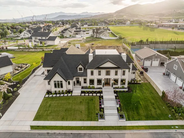 Stately white exterior with black trim, featuring a symmetrical facade