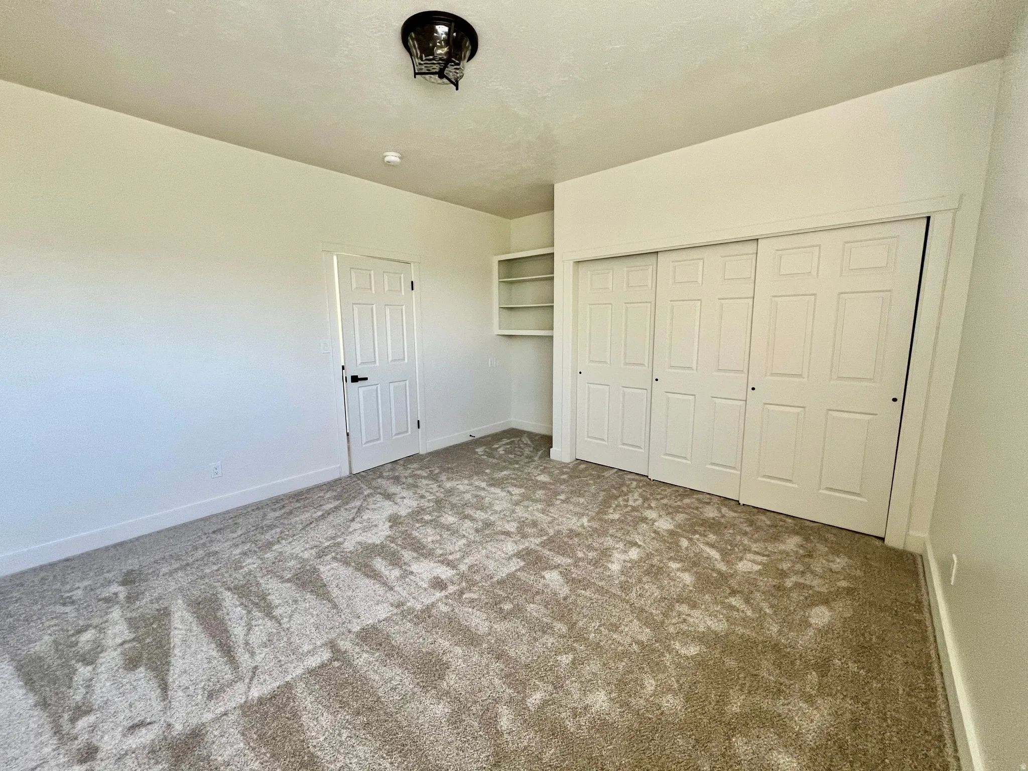 Neutral-toned carpeting throughout