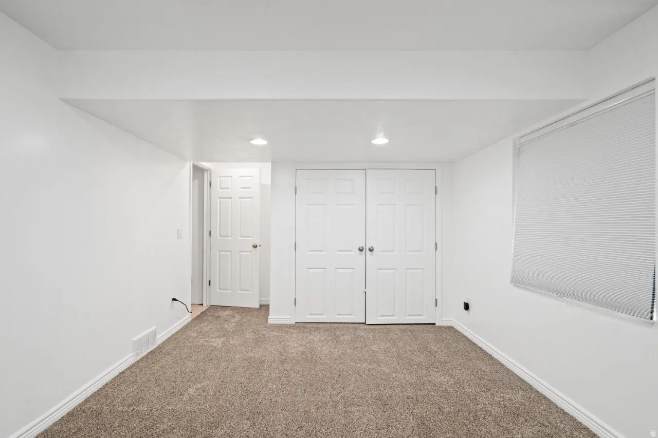 Below grade area featuring carpet and recessed lighting