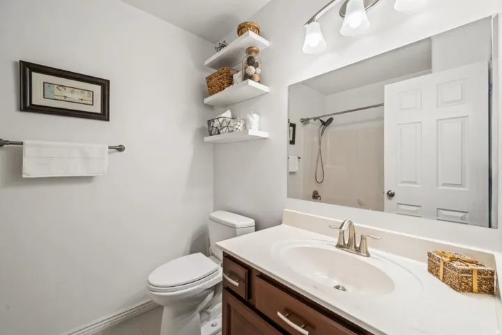 Full bath with vanity and a shower
