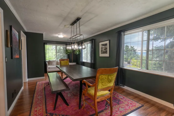 Formal dining off the kitchen, lots of natural light, fun updated light fixtures !