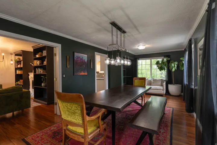 Dining area featuring wood-finish floor, windows at each end!