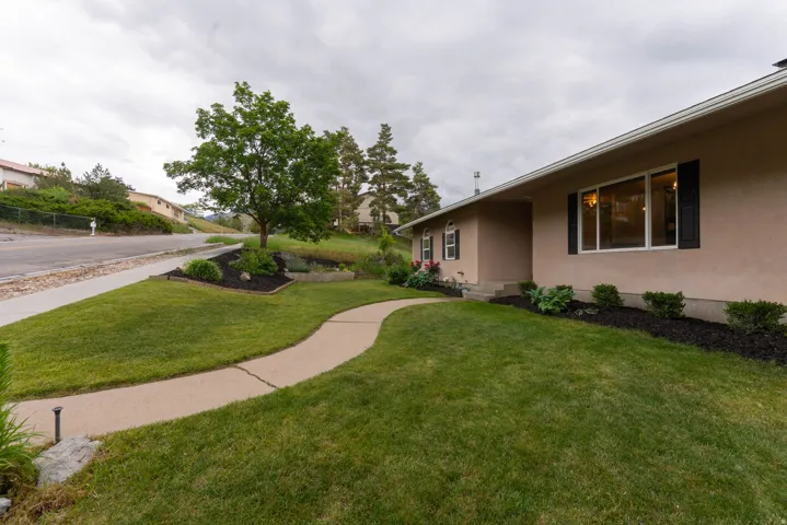 Minutes walk to Golf Course, manicured lot with views galore !