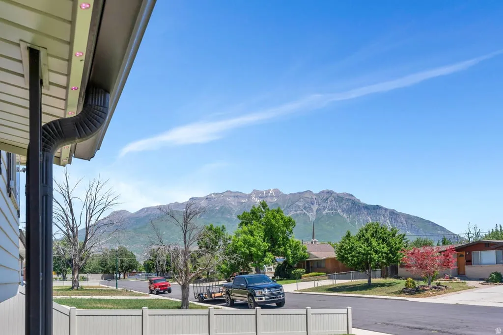 Mountain backdrop with visible peaks and a clear blue sky