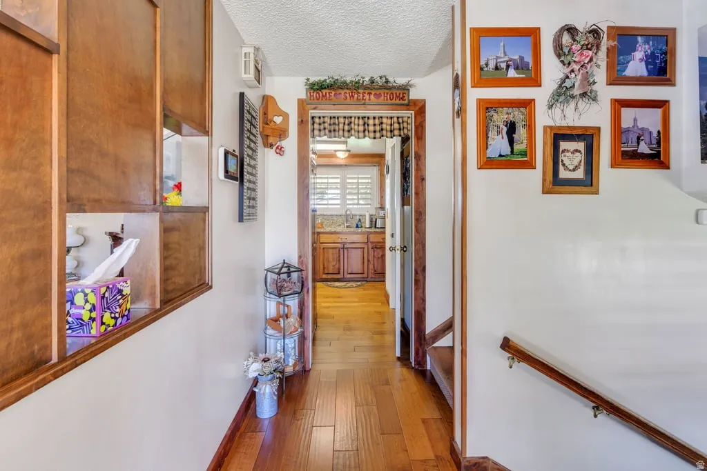 Hallway with wood-finish flooring