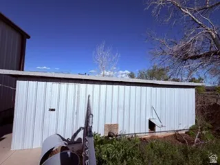 Chicken/pheasant coop - Corrugated metal outbuilding with a flat roof structure