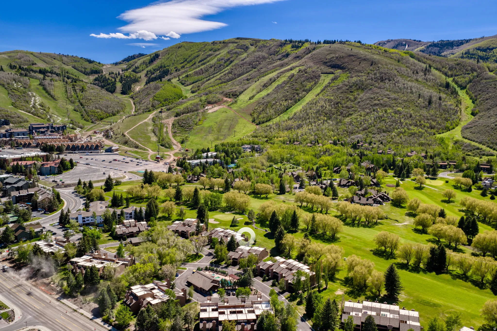 Aerial perspective showcasing the property within a mountainous landscape
